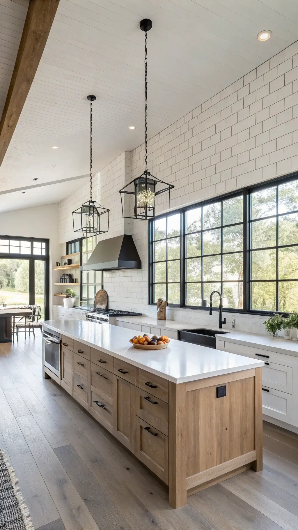 Modern farmhouse kitchen with concrete countertops, white oak cabinets, and black steel-framed windows, decorated with minimalist ceramics and preserved botanicals in colors of warm white, charcoal, natural oak, and soft green accents.